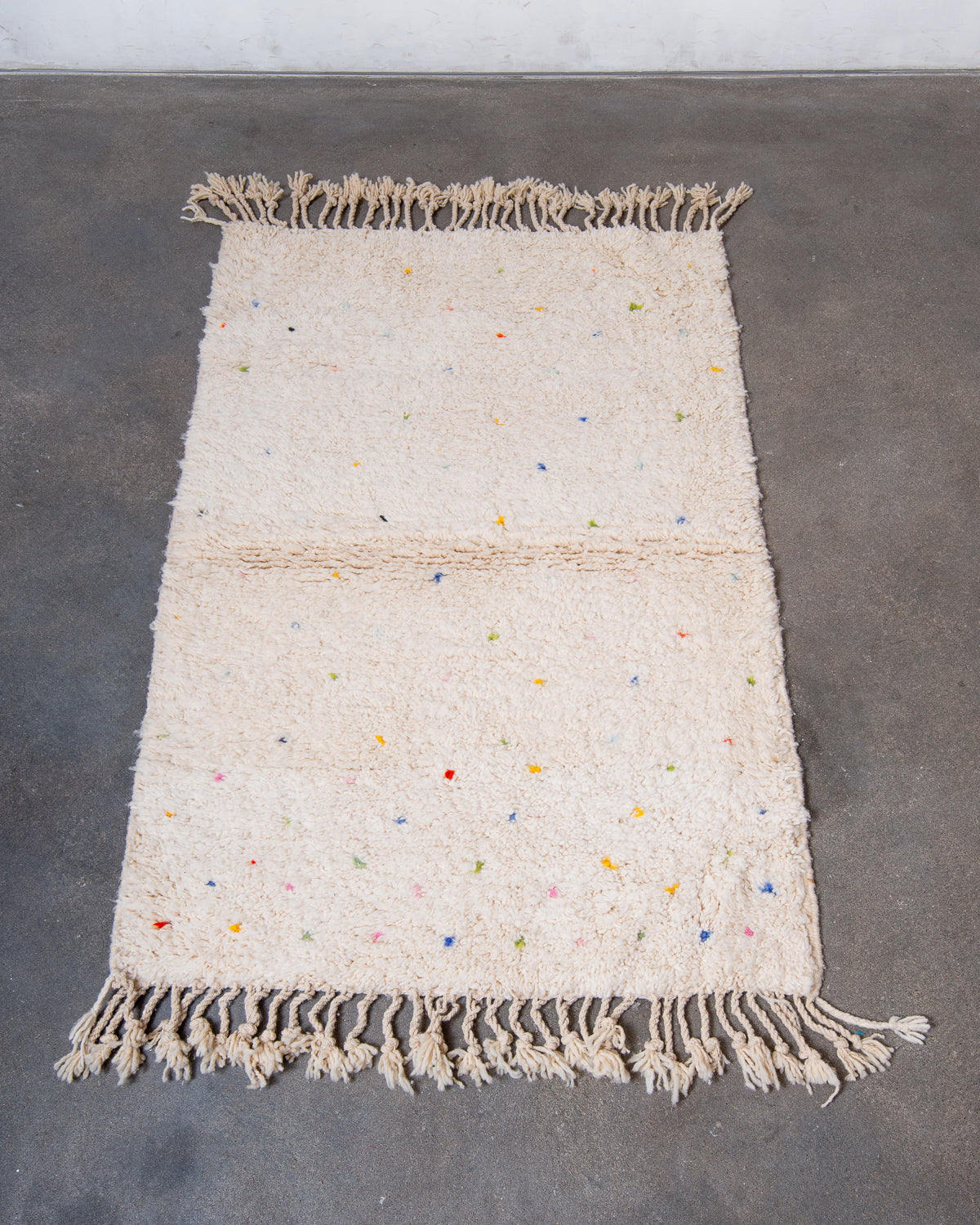 Modern, designer, handcrafted Berber rug from Morocco. Beniourain carpet with beautiful colours and patterns and fluffy wool texture.